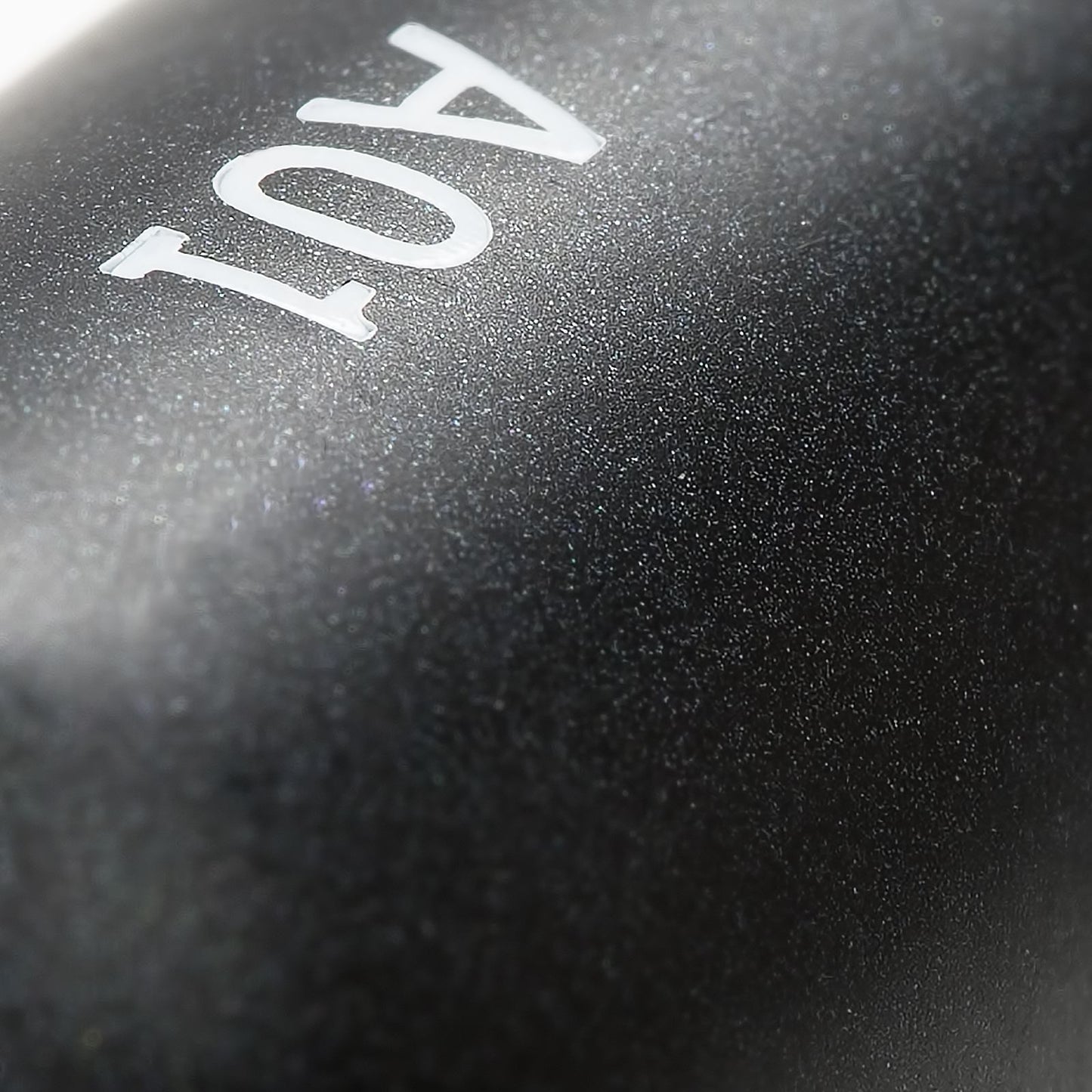Close-up view of black Pencil Makeup Brush handle with "A01" engraving.