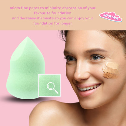 Close-up of a smiling woman using the 4-in-1 Marvel Makeup Blending Sponge in mint green with foundation swatches on her cheek, highlighting the sponge's fine pores and ergonomic design against a pink background.