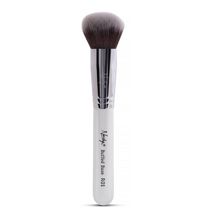 Nanshy Buffed Base brush with soft rose petal bristles, white ergonomic handle, and sturdy copper ferrule, perfect for applying and buffing in foundation.