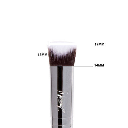 Close-up of a sleek Concealer 3D brush with ultra-soft, medium density synthetic bristles and an engraved copper ferrule.