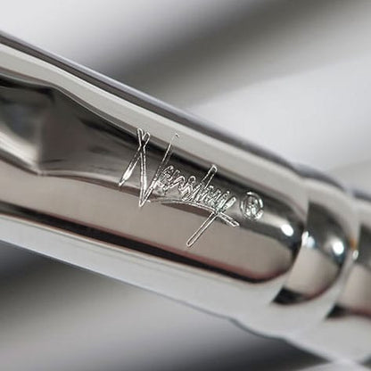 Close-up of Nanshy's sleek, pearl-coated handle brush with engraved logo.